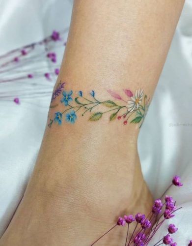 18 Unique Flower Ankle Tattoo Ideas: Stunning Designs for Nature Lovers 2024 Wildflower Ankle Tattoo Wrap Around, Flower Ankle Tattoo Wrap Around, Pretty Foot Tattoos For Women, Flower Ankle Tattoos, Flower Ankle Tattoo, Wrap Around Ankle Tattoos, Ankle Tattoo Ideas, Turtle Tattoo Designs, Ankle Bracelet Tattoo