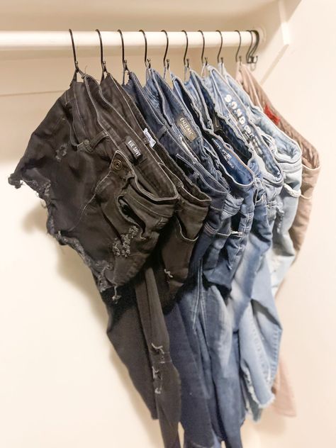 The Best Closet Hack for Hanging Your Jeans, Pants & Even Shorts - winey women Closet With Hooks Only, Hanging Pants On Shower Hooks, Hanging Jeans With Shower Hooks, Hooks For Jeans In Closet, Hang Jeans On Shower Curtain Hooks, Shower Hooks For Jeans, How To Hang Shorts On A Hanger, S Hooks For Jeans, Hanging Shorts In Closet