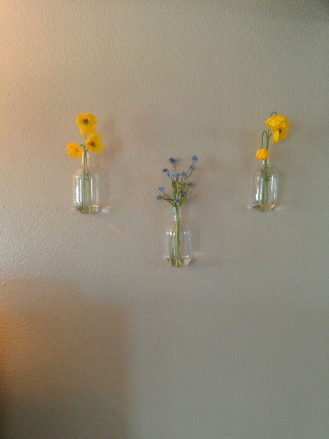 Finally hung up my awesome wall vases! Bottle Flower Wall, Flower Vase Wall Decor, Hanging Vases On Wall, Flower Vase Wall, Wall Behind Bed, Hallway Table Decor, Hanging Wall Vase, Wall Flower Vases, Glass Wall Vase