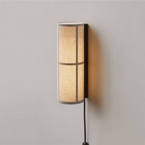 Crafted with meticulous attention to detail, this wall light features a sleek metal frame that gracefully envelops the textured fabric shade. The soft, diffused light it casts will bring a warm, inviting glow to any space, making it perfect for creating a tranquil corner in your living room, bedroom, or hallway. Available in a range of finishes to suit your decor, this sconce embodies contemporary design while providing the timeless beauty of gentle illumination. 
 What does it mean to set of 2? The Hashira, Valerie Objects, Practical Lighting, Norm Architects, Mode Design, Led Desk Lamp, Edison Bulb, Metal Lighting, Wall Light Fixtures