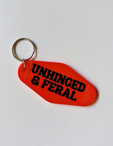 "Unhinged and feral motel style keychain - Made of acrylic plastic - Design made with permanent and durable vinyl - 3.5\" x 1.5\" - Front and back design *clear glitter keychain is one sided only!* - Keychain colors Clear Glitter, Sage, Light Blue, Lime and Transparent Lavendar come with gold split rings. All others are silver! INSTRUCTIONS FOR ORDERING 1) Select color of keychain you would like (see 2nd to last photo for options) 2) Pick color of vinyl you would like (see last photo for options Funny Sayings For Keychains, Funny Key Chains, Key Chains Diy, Make Keychains, Clear Acrylic Keychain, Rainbow Vinyl, Keychain Designs, Glitter Keychain, Silly Gifts