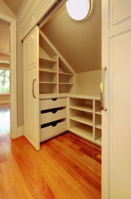 Sloped or slanted ceilings and knee walls can present problems when it comes to storage. Check out these sloped ceiling closets to find a solution! #smallclosetorganizationideas Closet Design Layout Slanted Ceiling, Mezzanine Closet, Sloped Ceiling Closet, Attic Bedroom Closets, Small Space Storage Bedroom, Bedroom Storage For Small Rooms, Attic Bedroom Storage, Slanted Walls, Diy Bedroom Storage