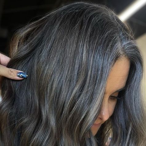 206 likes, 13 comments - the.balayage.babe on February 25, 2023: "GRAY BLENDING BALAYAGE✨ gray blending & balayage don’t usually go together but for this babe we made it work!! I brought back some of her natural dark base color to add depth & dimension but also brought up her lightness to keep it fresh & soft as it grows. I toned her with a darker ash color to keep it blended with her gray 🤤 PRODUCTS: •Artist: @the.balayage.babe •Salon: @AuraHairCo South FL •Lightener: @Wellahairpro Blondor Brunette With Silver Highlights, Blending Balayage, Gray Blending Hair Dark Brown, Balayage Gray, Long Barrel Curling Iron, Dark Grey Hair Color, Gray Blending, Grey Blending, Dark Grey Hair