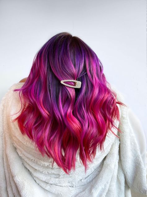 Chromatic Charm: Elegant Hairstyle Ideas That Celebrate Color Sun Set Hair Color, Purple Sunset Hair, Red Pink And Purple Hair, Pink Purple Red Hair, Elumen Hair Color Ideas, Purple To Red Ombre Hair, Valentines Day Hair Color, Valentines Hair Color, Warm Purple Hair