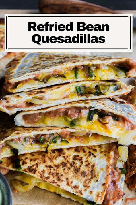 These Refried Bean Quesadillas are so tasty with such minimal ingredients. Salsa is mixed with the beans to add easy flavor, then poblano peppers and onions are sautéd until soft, and it’s all topped with gooey melted cheese. An easy quick vegetarian lunch or meal that’ll definitely hit the spot. Quesadilla With Refried Beans, Bean Cheese Quesadilla, Refried Beans Quesadilla Recipes, Refried Bean Quesadilla Recipes, Refried Beans Quesadilla, Refried Bean Quesadilla, Refried Bean Recipes, Quesadilla Recipes Vegetarian, Baked Quesadilla