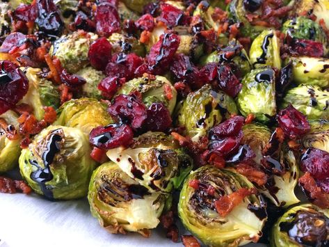 The perfect way to serve up Brussels sprouts, these ones are topped with bacon, cranberries and drizzled with a balsamic vinegar reduction! Roasted Brussel Sprouts With Cranberries, Brussel Sprouts With Cranberries, Broccoli With Bacon, Brussels Sprouts With Cranberries, Bacon Brussels Sprouts, Roasted Sprouts, Brown Sugar Bacon, Best Thanksgiving Recipes, Bacon Brussel Sprouts