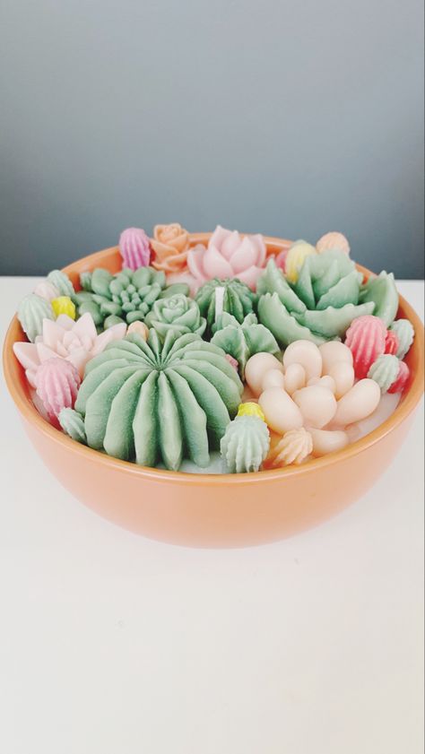 This Succulent Candle is the perfect way to add a unique and decorative touch to your home. It features a one-of-a-kind design with a variety of colourful succulents and plants, creating a beautiful and eye-catching centerpiece. This candle is sure to be a conversation starter, and it's also a great way to bring a bit of nature indoors. Enjoy the unique and beautiful design of this succulent candle! Colourful Succulents, Bougie Diy, Succulent Candle Centerpiece, Succulent Candles, Diy Bougie, Plant Candle, Succulent Candle, Cactus Candles, Succulents Candles