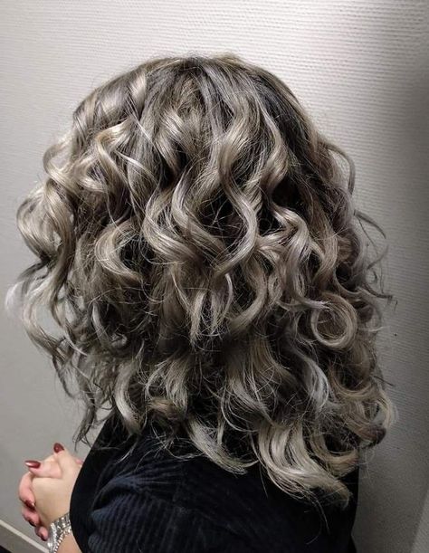 Butterfly Haircuts Every Girl Needs to Try Ash Blonde Curly Hair Natural, Curly Ash Hair, Curly Hair With Grey Highlights, Ash Blonde Wavy Hair, Curly Hair Silver Highlights, Ash Brown Balayage Curly Hair, Icy Blonde Highlights Curly Hair, Ash Blonde Balayage Curly Hair, Ash Blonde Hair Curly