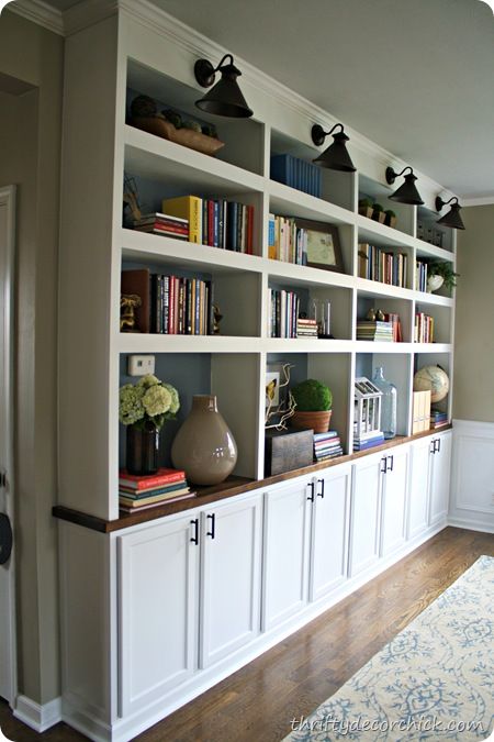 DIY built in bookcases butcher block- used upper cabinets for bases. 12 inches deep. can still have a table in front of it. Would this work for breakfast room? Have larger shelves open and then upper cabinet doors for narrower shelves at top? Built In Bookcases, Thrifty Decor Chick, Ideas Hogar, Estantes Flotantes, Built In Bookcase, Upper Cabinets, Design Del Prodotto, Home Library, Book Shelf