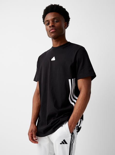 Activewear > Men > Trainingbr>Adidas - Future Icons white-on-black accent longline tee Adidasbr>ul>li>adidas at I.FIV5/li>li>A casual basic featuring a monochrome silicone "Badge of Sport" and three signature bands on the side/li>li>Ultra comfortable, soft and stretch 100% cotton jersey/li>li>Ribbed crew neck/li>li>Long relaxed fit/li>/ul>br>br>The size of the item pictured is medium Training Tops, Sports Training, Black Set, Mens Sportswear, At The Gym, Black Accents, Mens Activewear, Gym Wear, Athletic Wear