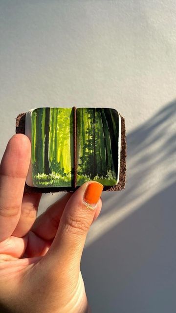 PAPERWRLD | JOURNALING STORE on Instagram: "Painting a forest in a mini journal 💚 In love with the Painting in the mini journal. What's your favorite subject to paint or draw in your mini journal? Leave a comment and let us know! And don't forget to check out the amazing journals at paperwrld.com . Work by @the_tinted_palette . Shop Now ➨ www.paperwrld.com Follow ➨ @paperwrldshop . Daily journal inspiration . #paperwrldshop #paperwrld #minijournal #tinypainting #explorepage #dailyjournal #aesth Mini Forest Painting, Painting A Forest, Wet Watercolor, Mini Art Journal, Mini Watercolor, Forest Drawing, Instagram Painting, Favorite Subject, Mini Journal