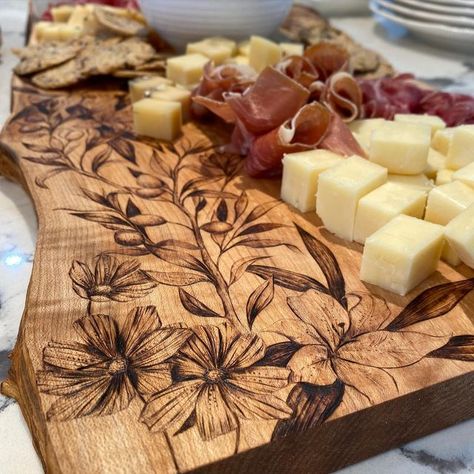 Hannah | Pyrography Artist on Instagram: "Loved seeing this beautiful display on @lexi.m96 ‘s charcuterie board Send pictures of my pieces in your home/of you using them! It makes my heart happy and is one of my favourite parts of creating these pieces for you all 💛" Wood Burning Charcuterie Board, S Charcuterie Board, Woodburning Projects, Wood Artwork, Wood Burning Patterns, Gift Inspo, Cnc Projects, Artist On Instagram, Pyrography