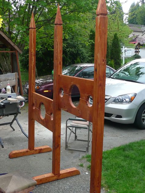 I had originally wanted to carve slots into the upright posts for the stocks to slide into, but this would have been too time consuming, so instead I simply cut some strips of poplar and used them as track guides for the uprights.I stained everything with my redwood decking stain, and started to assemble.Here is my stockade, as of Sunday evening, all staned and put together, with the exception of the angled braces. I still need to stain and attach those. I am also hoping to make a Halloween Yard Props, Sweet Props, Redwood Decking, Pirate Gifts, Door Games, Medieval Party, Medieval Furniture, Halloween Props Diy, Haunted Forest