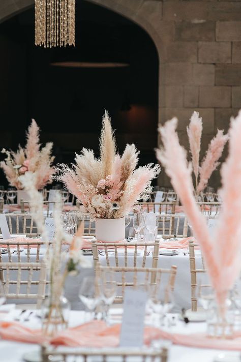 Boho luxe wedding with pink and white pampas grass table centrepieces and decor Flower And Pampas Centerpieces, Boho Pink Wedding Decorations, Pampas Grass Top Table, Pink Boho Table Decor, Pink Pampas Wedding Decor, Pampas Grass Centre Piece, Dry Flower Wedding Decor, Wedding Table Decorations Pampas, Pampas Wedding Decor Table