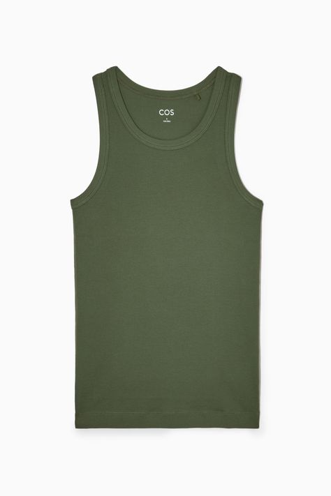 Made from organic cotton with a touch of stretch, this slim-fit tank top is an essential on warmer days. - Round neck- Sleeveless design- Organic cotton is grown from non-genetically modified seeds without chemical fertilizers or pesticides 97% Organic cotton, 3% Elastane / Machine washableBack length of size S is 24¼" Cos Shirt, Mini Wrap Skirt, Wool Mini Skirt, Belted Trench Coat, Ribbed Tank Top, Wool Turtleneck, Ribbed Tank Tops, Ribbed Tank, Wool Pants