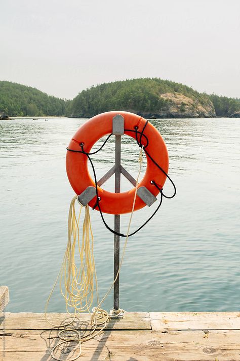 Life preserver water safety ring on a boat dock at Sharpe Cove in Deception Pass State Park, Washington during summer time. River Life Aesthetic, Life Preserver Ring, River Garden, Deception Pass, Life Preserver, Life Ring, Water Safety, Christmas Yard Decorations, Christmas Yard