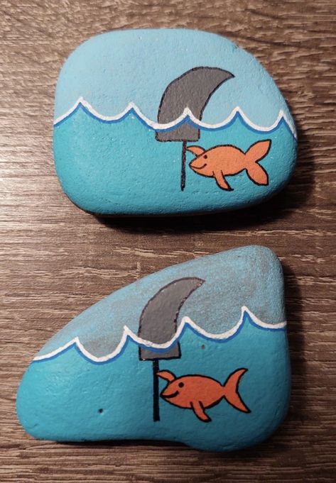 Goldfish Rock Painting, Painted Rocks Shark, Shark Rock Painting Ideas, Lake Rock Painting Ideas, Fishing Rock Painting, Mermaid Rock Painting, Shark Painting Easy, Painted Shark Rock, Mermaid Painted Rocks