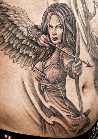 30 Best Warrior Tattoo Designs And Meanings With Pictures | Styles At Life Angel Girl Tattoo, Guardian Tattoo, Angel Warrior Tattoo, Archer Tattoo, Guardian Angel Tattoo Designs, Female Warrior Tattoo, Warrior Angel, Valkyrie Tattoo, Guardian Angel Tattoo