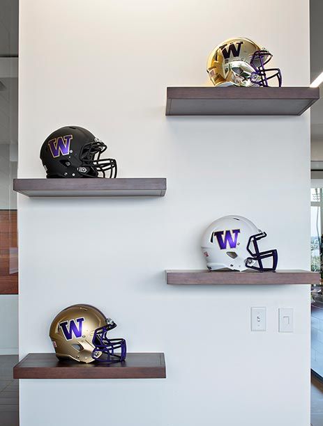 Helmet display Football Helmet Shelf Display, Shelves For Sports Memorabilia, Man Cave Display Shelves, Football Helmet Display Ideas Man Caves, How To Display Football Helmets, Sports Shelf Display Shelves, Man Cave Display Ideas, Football Helmet Wall Display, Football Organization Ideas