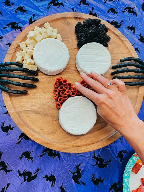 How To Make A Hocus Pocus Charcuterie Board | Hocus Pocus 2, the sequel to the 1993 movie will be available to stream on Disney+ on September 30, 2022.If you’re throwing a Hocus Pocus Viewing Party or Halloween party, we have the perfect Hocus Pocus Snack Board for you. It’s not even hard to make…no magic required! | Healthy Family Project #hocuspocus #halloween #charcuterieboards #snackboards Hocus Pocus Meat And Cheese Board, Hocus Picks Charcuterie, Witch Theme Charcuterie Board, Disney Halloween Charcuterie Board, Hocus Pocus Board Food, Sanderson Sisters Charcuterie, Halloween Charcuterie Board Hocus Pocus, Sanderson Sister Charcuterie Board, Hocus Locus Cheeseboard