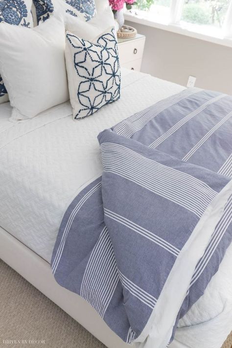 Great advice on how to choose a duvet and a comforter insert! #bedroom #bedrooms #bedding How To Fold Comforter On Bed, Layer A Bed, Guest Room Paint, Bed Steps, Driven By Decor, Bed Making, Blue Duvet, Striped Duvet, Bedrooms Decor