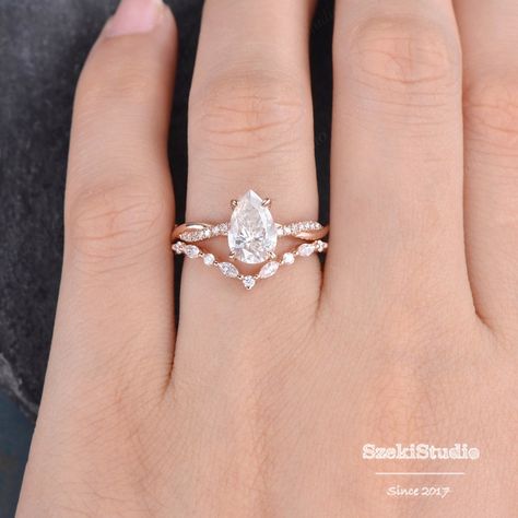 Pear Shaped Moissanite Engagement Ring Set Rose Gold Twist - Etsy Australia Rose Gold Pear Engagement Ring Set, Marquise Engagement Ring Twisted Band, Marquise Rose Gold Engagement Ring, Pear Engagement Ring With Wedding Band, Rose Gold Pear Engagement Ring, Unique Gold Engagement Rings, Marquise Bridal, Pretty Engagement Rings, Half Eternity Ring Diamond