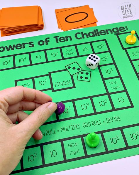 Help students understand what happens to numbers when we multiply and divide by powers of ten using this hands on math game. Students build numbers on their place value mat and then multiply and divide. They also practice seeing and using powers of ten written with exponents. Grab it free! Multiply & Divide by Powers of Ten Game: Includes Exponents Multiplying By Powers Of 10, Powers Of Ten Anchor Chart, Teaching Powers Of 10, Multiplying And Dividing By Powers Of 10, Powers Of 10 Activities, Place Value Mat, 5th Grade Math Games, Printable Math Games, Free Math Games