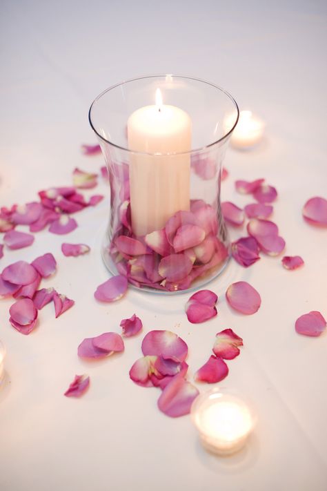 Rose petals scattered on tables