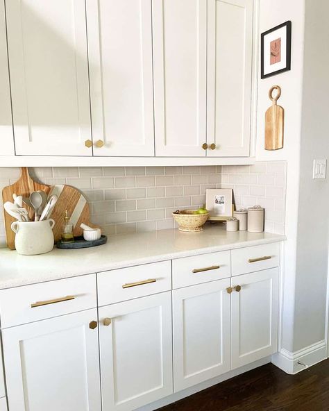 White Shaker Cabinets Showcase Gold Hardware - Soul & Lane Kitchen Cabinets Gold Hardware, Kitchen Cabinets With Gold Hardware, White Kitchen Hardware, 2 Tone Kitchen Cabinets, Gold Hardware Kitchen, Cabinets With Gold Hardware, White Kitchen Cabinet Hardware, Cabinet Hardware Ideas, Shaker Cabinets Kitchen