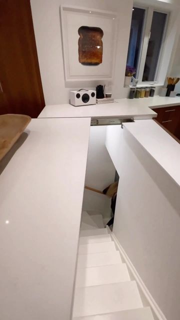 Finished Basements NJ ™ on Instagram: "⁣Need a little inspiration for your next kitchen renovation? This hidden staircase is on our bucket list!⠀ ⠀ By: @meetmiranda⠀ ⠀ #kitchenremodel #kitchengoals ⠀ #hiddenstaircase #kitchenreno" Hidden Basement Door In Kitchen, Hidden Stairs In Kitchen, Secret Staircase To Basement, Hidden Basement Stairs, Hidden Staircase To Basement, Secret Staircase Hidden Rooms, Hidden Stairs Under Kitchen Island, Hidden Staircase Under Kitchen Island, Stairs Under Kitchen Island