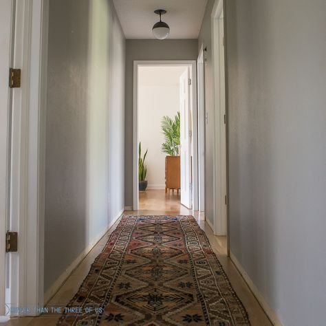 My hallway got a mini makeover! Come on over and see the before/progress which includes Updating a Hallway with a Vintage Persian Rug and pendant lights! Art In Hallway, Hallway Rugs Ideas, Hallway Pendant Lighting, Vintage Modern Home, Hallway Gallery Wall, Travel Gallery Wall, Mirror Interior Design, Hallway Flooring, Hallway Carpet Runners