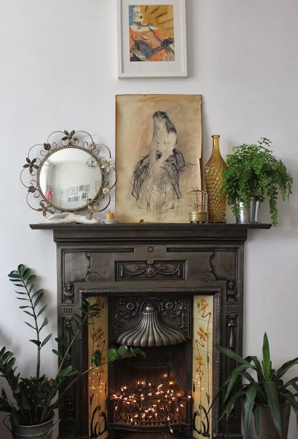 At Home: Decorating With Plants....like the idea of the twinkle lights in fireplace Empty Fireplace Ideas, Decorating With Plants, Blue Candle, Dining Room Fireplace, Victorian Fireplace, Dining Room Sideboard, London Home, Bedroom Fireplace, Faux Fireplace