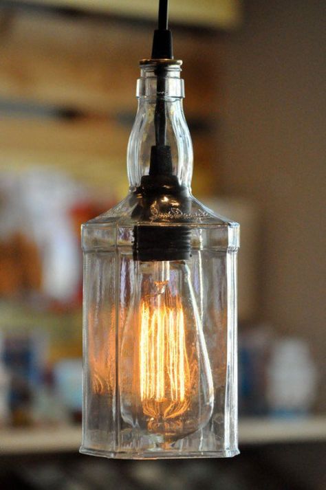 These are made for whiskey bottles. My son made similar ones from canning jars. Jack Daniels Lampe, Jack Daniels Bottle, Diy Lampe, Whisky Bottle, Hanging Pendant Lamp, Lighting Techniques, Bottle Pendant, Recycled Bottle, Bottle Lamp