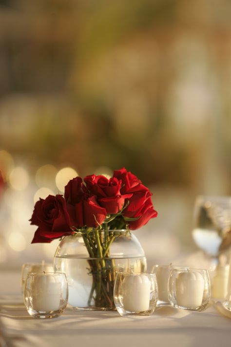 Digging the simplicity of this :-) Rose Centerpieces Simple, Red Rose Centerpieces Simple, Red Rose Engagement Party, Red Roses Engagement Decor, Small Red Roses Centerpieces, Red Rose Centrepiece, Candle Lit Wedding Reception, Small Red Rose Centerpiece, Roses Centerpiece