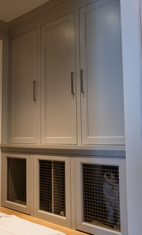 A custom made built-in mudroom closet with two dog crates built into the bottom. Mudroom Dog Crate Built Ins, Built In Dog Watering Station, Dog Crate In Mudroom, Custom Built Dog Crates, Diy Dog Crate Built In, Integrated Dog Crate, Built In Dog Crate Mudroom, Mudroom With Dog Crate, Dog Kennel Built Into Wall