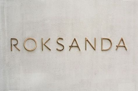 Roksanda Gold Signage on Concrete #logo #lettering #gold Gold Signage, Bakery Interior, Shop Signage, Wall Signage, Exterior Signage, Night Clubs, Presentation Ideas, Shop Sign, Gold Sign