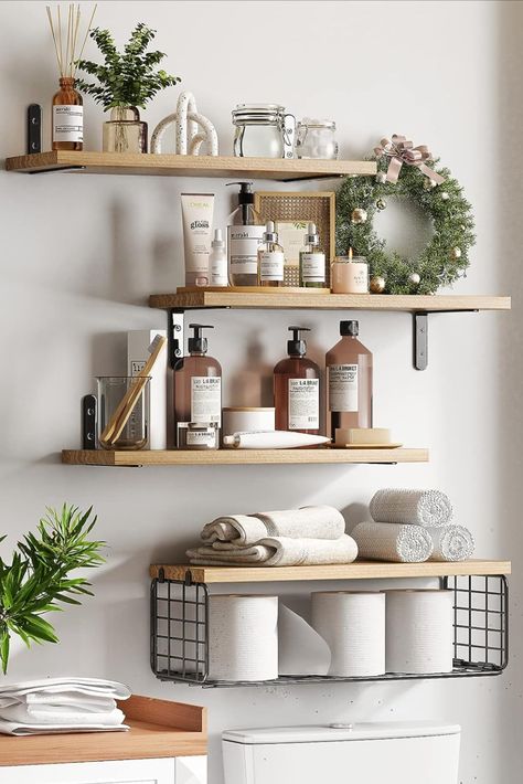 Transform your bathroom with beautifully decorated wooden shelves. Explore creative ways to add warmth and character to your bathroom while staying organized. From rustic chic to contemporary elegance, discover the perfect wooden shelf decor ideas to complete your bathroom oasis! Fixwal 4+1 Tier Floating Shelves, Rustic Wood Wall Shelf, Bathroom Shelves Over Toilet with Wire Storage Basket, Farmhouse Wall Decor for Bedroom, Kitchen, Living Room and Plants (Rustic Brown) Minimal Bathroom Decor, Float Shelf, Wooden Bathroom Shelves, Cat Stand, Toronto Apartment, Spare Bathroom, Shelves Over Toilet, Bathroom Shelves Over Toilet, Wand Organizer