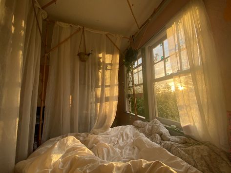 #bedroom #goldenhour #windows #canopy Gold Canopy Bed With Curtains, Patio Bedroom Ideas, Window By Bed Aesthetic, Bed Against Wall With Window, Bed With Curtains Around It Canopy, Four Post Bed With Curtains, Canopy On Slanted Ceiling, Bed Canopy Window, Canopy Bed Next To Window