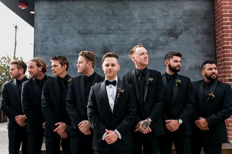 This groom and groomsmen looked stylish in matching black suits with the groom wearing a black suit and white button up while the groomsmen wearing black suits and black shirts for their Clementine Hall Wedding in Nashville, TN | John Myers Photography & Videography Grooms Men Black Suits, Black Suits Wedding Groomsmen, Groom And Groomsmen Black Suit, Groom Stand Out From Groomsmen, Mens Black Suit Outfit Wedding, Groom Black Suit Wedding, Black On Black Groomsmen, Groomsmen All Black Attire, Wedding Usher Attire