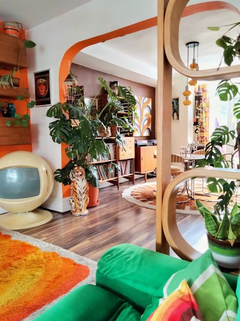 The orange on the living room accent wall and the inner door arch is a Valspar custom color. The dining room is painted in Valspar's "Chocolate Bon Bon." <br><br><br><br><br> Credit: <a href="https://70shousemanchester.com/">Estelle Bilson</a> 70s Living Room, 70s Interior Design, 70s House, 70s Interior, 70s Home, Pub Decor, Deco Retro, Retro Interior, Cool Apartments