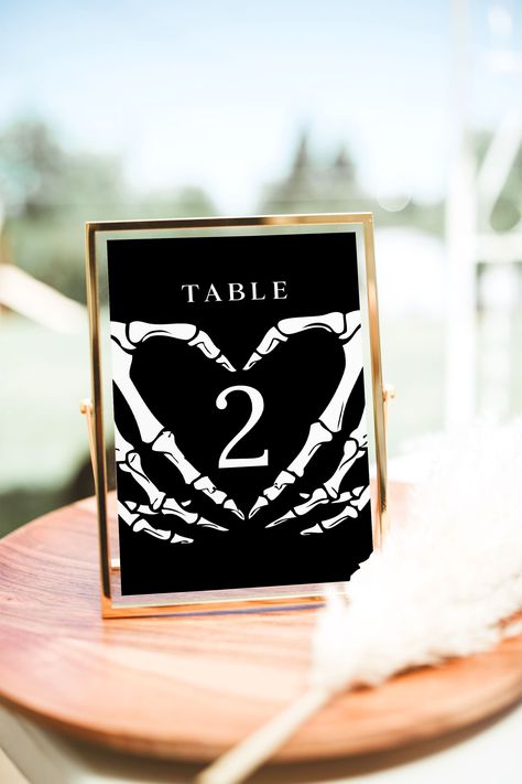 Halloween Wedding Table Numbers Template Enhance the gothic charm of your wedding reception with our dark and moody table number signs. These charming templates feature a beautiful dark and moody design and are perfect for your fall wedding, winter wedding or gothic bridal shower! This is a digital file *only*. No physical items will be provided upon purchase. After purchase, the template is available immediately for editing using Templett's online app in your browser (no software download requi Red And Black Rustic Wedding Decorations, Rustic Gothic Wedding Decorations, Goth Chic Wedding, Dark Moody Wedding Reception, Black Linens For Wedding, Maroon And Black Wedding Decorations, Moody Table Numbers, Halloween Wedding Table Numbers, Goth Wedding Signs