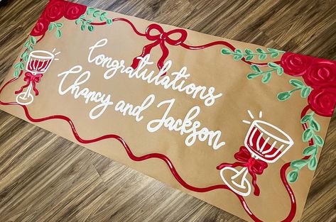 Such a simple and elegant banner design!! I love! ❤️🥂🫶🏼 #banner #banners #bannerdesign #brownpaperbanner #painting #shopsmall #smallbusiness #roses #red #drinks Holiday Banner Design, Parade Banner Ideas, Christmas Banner Painted, Hand Painted Banner Ideas, Painted Christmas Banner, Christmas Painted Banner, Painted Banner Ideas, Frat Wedding, Gameday Banner