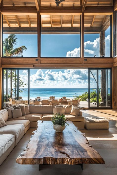 Interior of a beachfront home high ceiling full wall windows sliding doors with beach front tropical island views interior rustic style sectional. Discover what makes a dream beach house perfect for relaxation, fun, and seaside living. Modern Hawaiian House, Costa Rican Beach House, Rustic Beach House Interior, Hawaii Style Home, Brazil Beach House, Caribbean Homes Interiors, Airbnb Moodboard, Beach House California, Carribean House