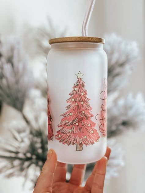 Winter wonderland Pink Christmas tree NOT DISHWASHER OR MICROWAVE-SAFE HAND WASH ONLY  For my PINK lovers!  16oz For hot and cold beverages  Comes with Lid and clear Straw Colored glass straws available for purchase  Frosted glass cup using sublimation where the design is I fused right into the glass. Not made with vinyl.  Want it personalized? I can add a name for you! Just leave a note in the personalization box!  This is the right aesthetic for your winter beverage of choice of Cocoa, Cappaci Glass Christmas Cups, Christmas Cup Ideas, Cup Christmas Tree, Glass Cup Christmas, Glass Iced Coffee Cup, Christmas Cups, Cute Coffee Cups, Holiday Cups, Cosy Christmas