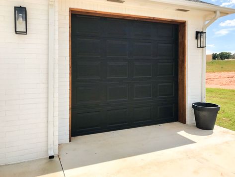 Black Garage Doors Tan House, Single Car Garage Door Ideas, White House Black Garage Door, Iron Ore Garage Door, Oyster White Exterior House, Garage Doors Glass, White Vinyl Siding, Black Windows Exterior, Black Garage Door