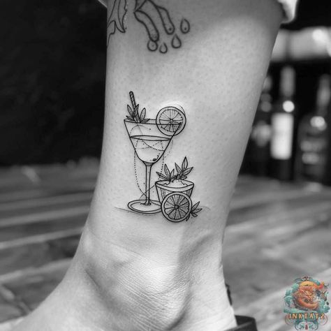 An intricate line art tattoo on the ankle, this design features a cocktail glass and a tequila bottle, beautifully accented with citrus and succulents, embodying the spirit of Mexican tattoos. Discover more tattoo ideas female at inktat2.com. Patron Tequila Tattoo, Champagne Tattoo, Tequila Tattoo, Sarah Tattoo, Blue Agave Plant, Line Art Tattoo, Mexican Tattoo, Tequila Bottle, Patron Tequila