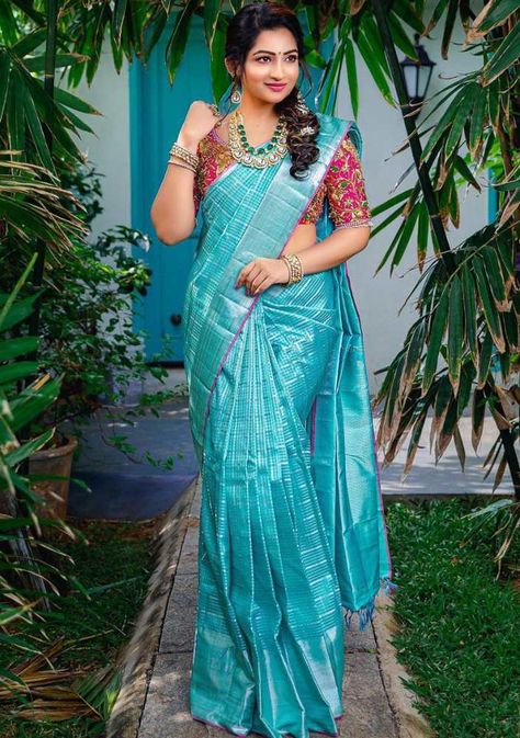 nakshatra nagesh blue silk saree and pink designer blouse Blue Silk Saree Look Traditional, Traditional Blouse Designs Indian Silk Sarees, Sky Blue Pattu Saree Wedding, Silk Saree Poses, Blue Silk Saree Blouse Designs, Contrast Blouses For Silk Sarees, New Silk Saree Collections, Silk Saree Look Traditional, Blue Colour Blouse Designs