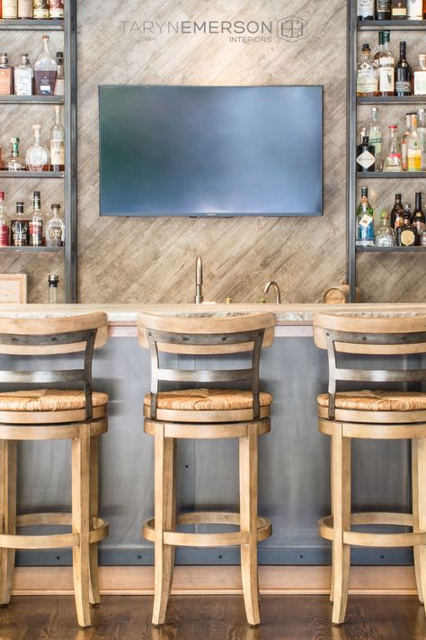 Gorgeous bar with farmhouse style sink and bar stools, angled wall shiplap with TV monitor for catching your favorite sports. Designed by Taryn Emerson, Lake Oswego, OR #mancave #homebars #farmhousesink #shiplap #lakeoswegointeriordesign #tarynemersoninteriors Tv Wall Bar Design, Basement Bar Tv Wall, Tv Over Bar, Bar Ideas For Home With Tv, Bar Wall With Tv, Bar Design With Tv, Bar With Shiplap Wall, Tv Behind Bar, Bar With Tv In Middle