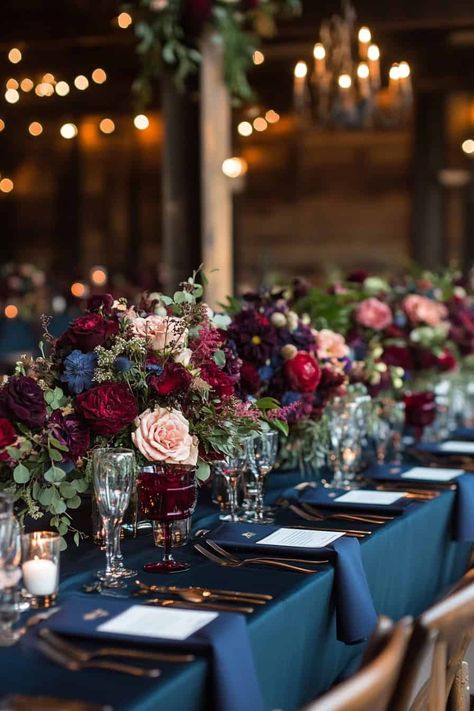 17 Enchanting Ideas For A Moody Fall Wedding • Moody Table Settings Wedding, Navy Blue And Burgundy Wedding Backdrop, Navy And Mauve Wedding Colors, Moody Themed Wedding, Navy Wine Wedding, Jewel Tone Forest Wedding, Moody Teal Wedding, Moody Wedding Theme Ideas, Dark Table Cloth Wedding