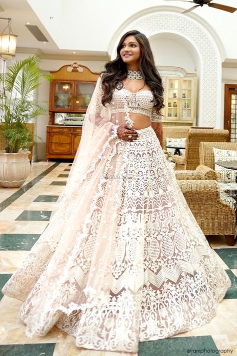 Aspiring to ace your wedding look with white bridal lehenga? Take notes from her wedding look-book.  Check out what she wore for other wedding ceremony through the link below.  #indianweddings #intimateweddings #shaadisaga #bridallehenga #whitebridallehenga #ivorylehenga #offwhitelehenga #engagementoutfit #indianbridalfashion #weddingtrends #indianweddingtrends White Wedding Dresses Reception, White Lehenga Look For Wedding, White Indian Wedding Outfits, Indian Wedding Outfits White, White Lehanga Design, White Lengha Bridal, Indian White Wedding Dress, Indian Wedding Dress White, Indian Bridal Lehenga White